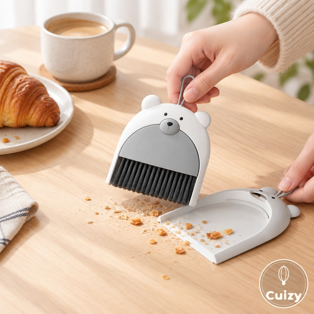 Balai et pelle Cuizy Dust en utilisation sur un plan de travail