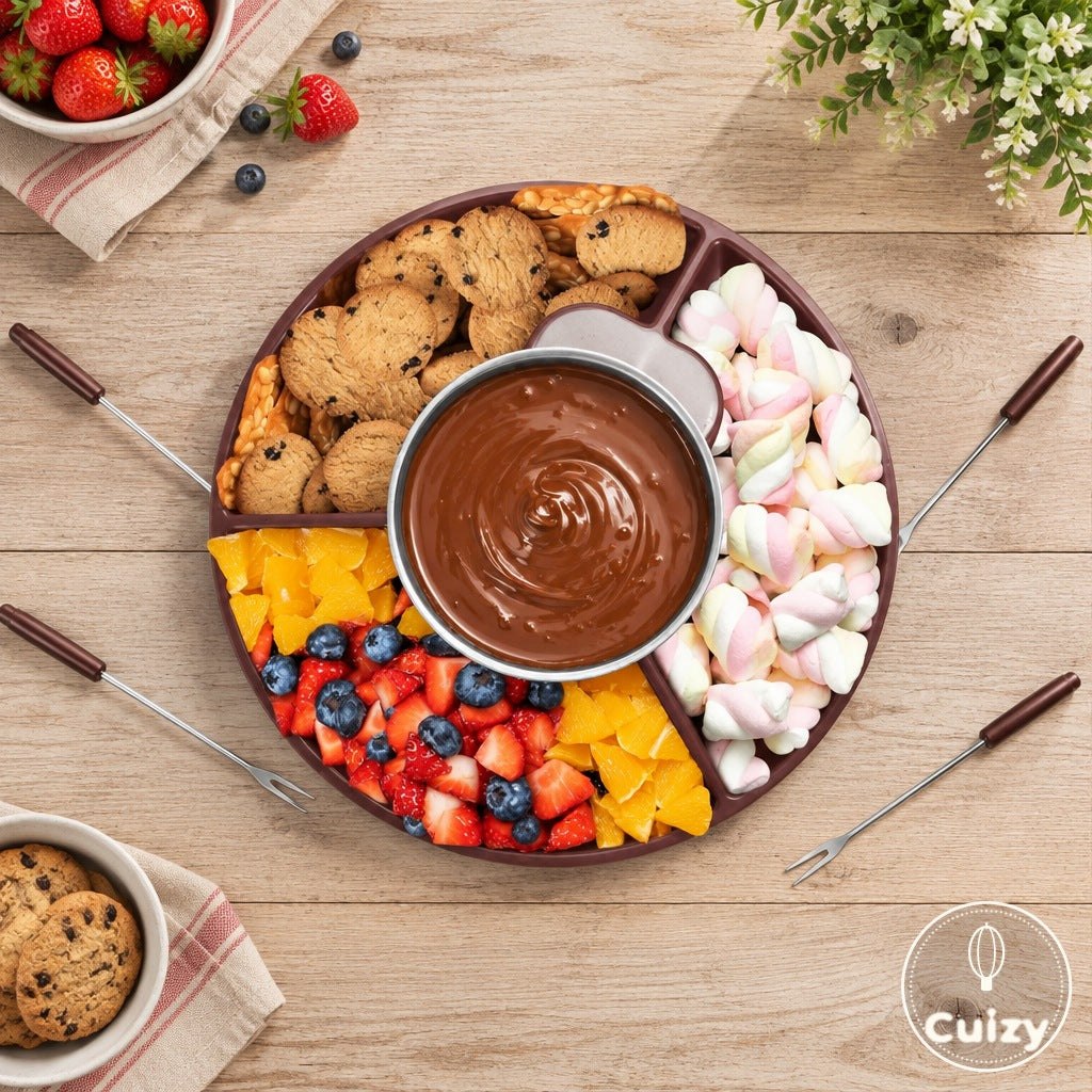 Vue du dessus du Cuizy Fondu entouré de fruits, guimauves, biscuits et fourchettes