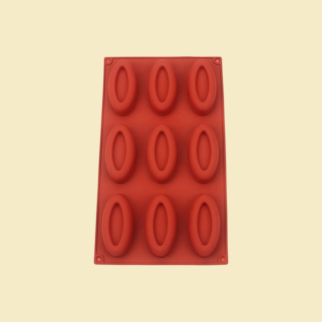 Moule à gâteaux silicone 9 empreintes sur fond neutre