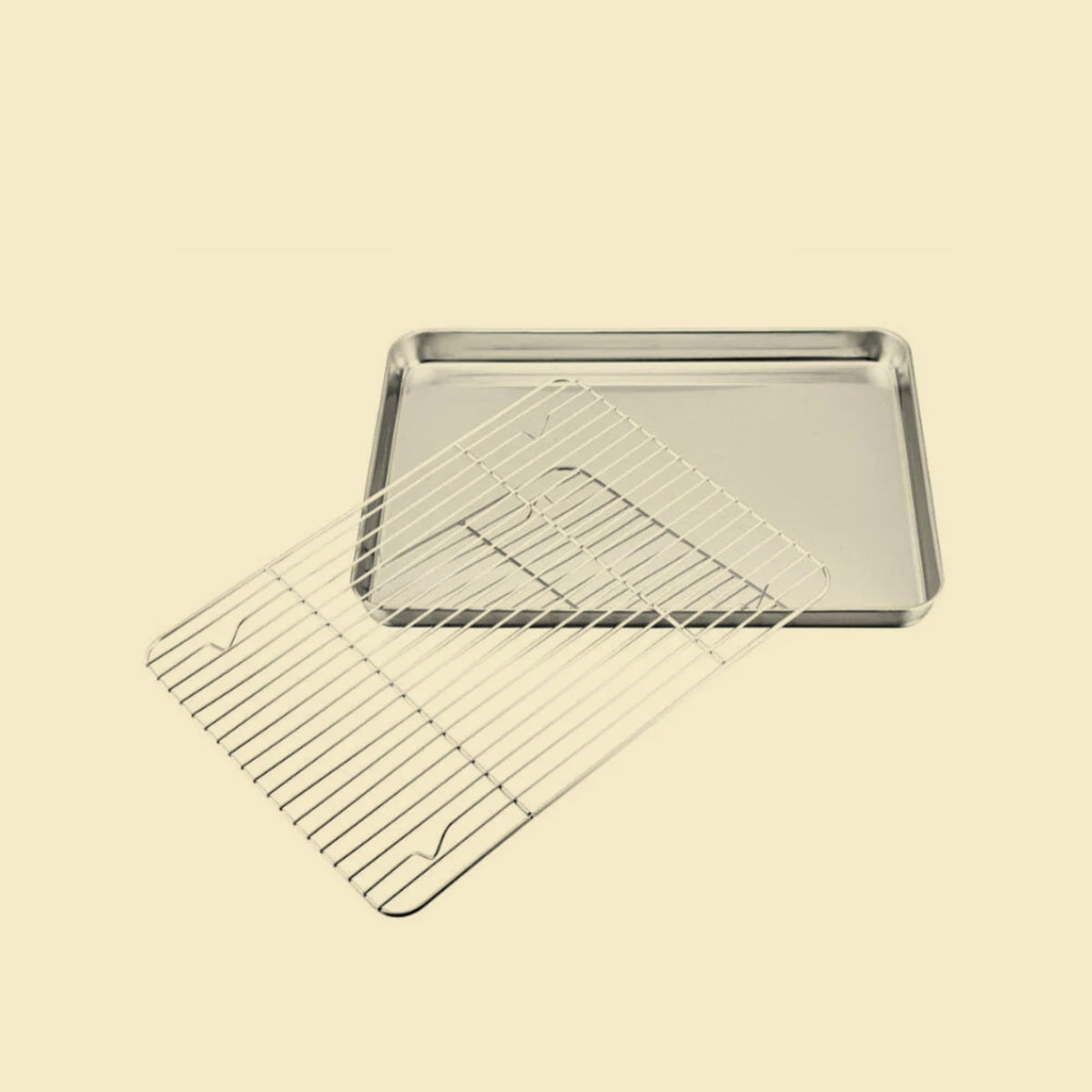 Plaque de cuisson en inox avec grille sur fond neutre